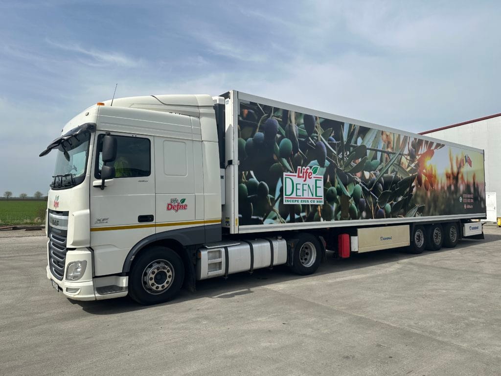 White lorry with a Life Defne trailer